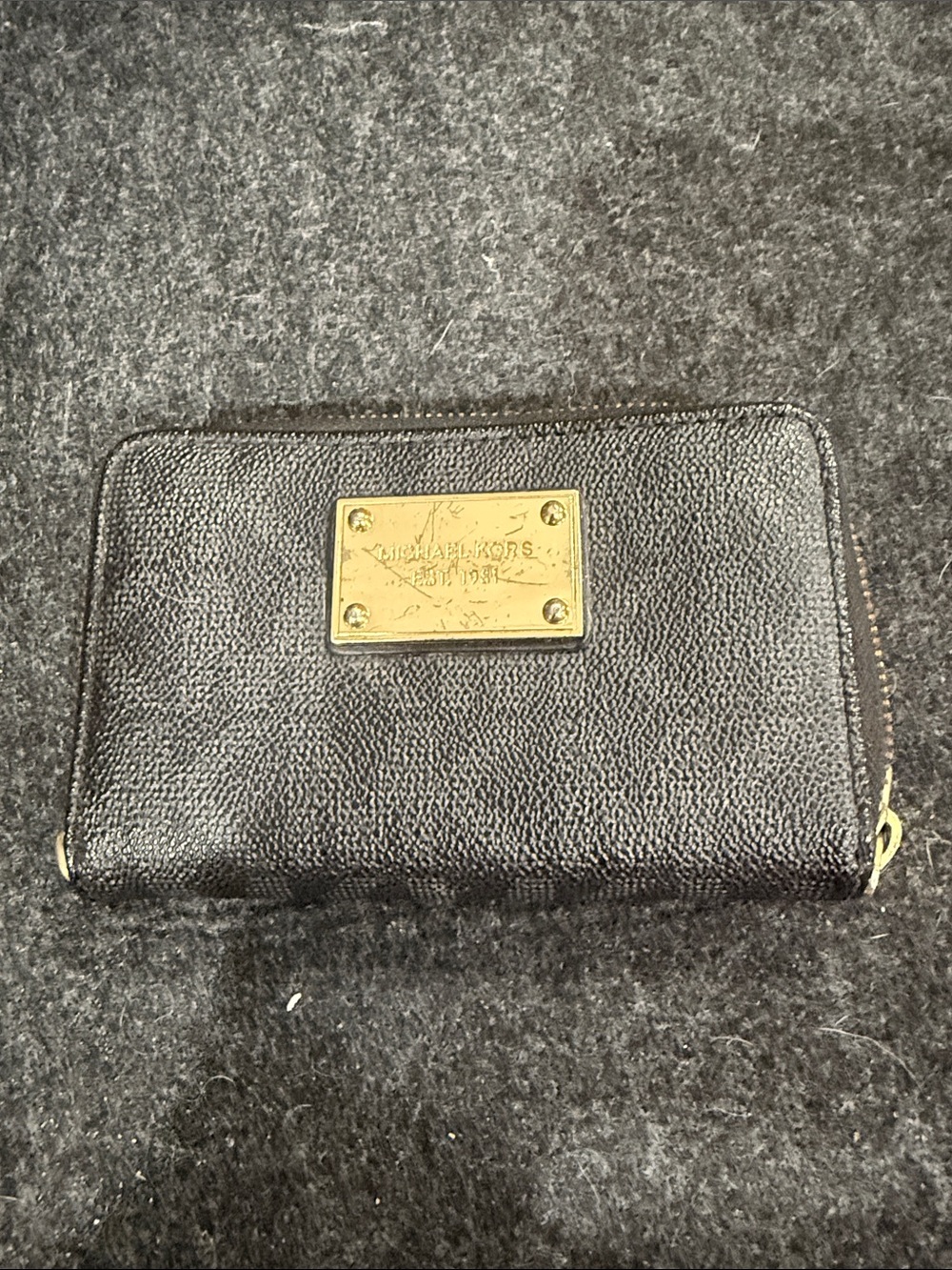 Michael Kors Black Pebbled Leather Zip Wallet with Gold Plate.